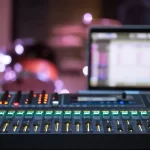 Digital mixer in a recording Studio , with a computer for recording music. The concept of creativity and show business. By puhimec