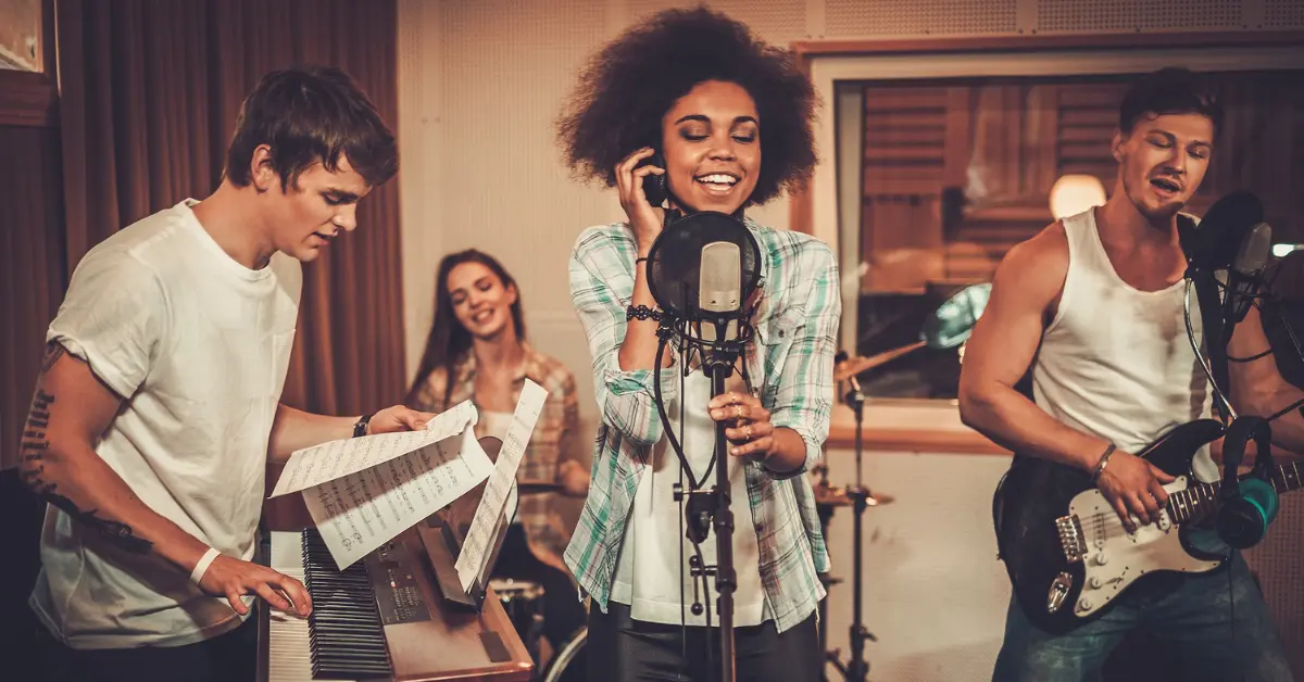 Musicians recording in a studio, showcasing collaboration